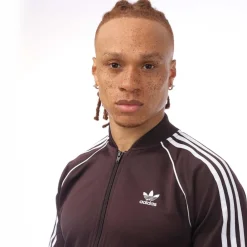 Tracksuits*adidas Originals SST Primeblue Track Top in Burgundy
