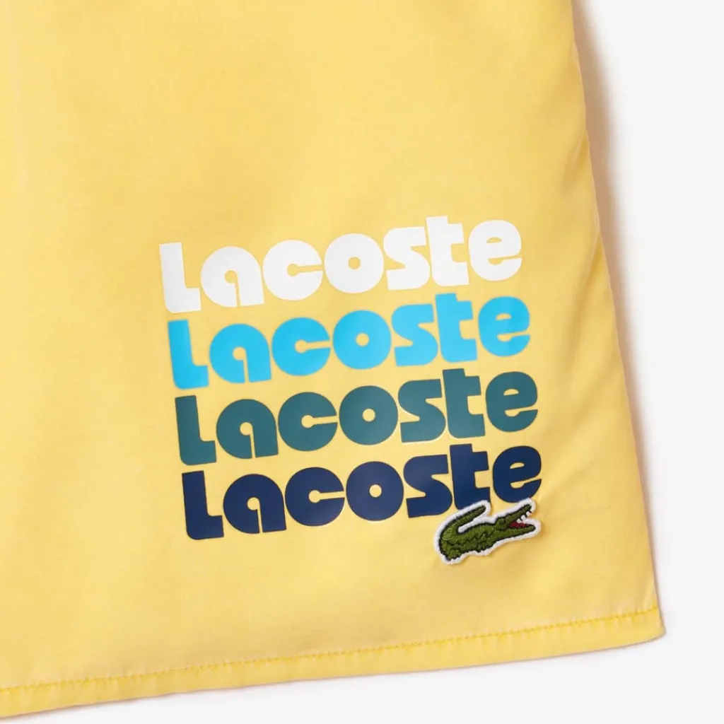 Shorts*Lacoste Mid Length Washed Effect Swim Trunks in Yellow