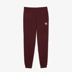 Trousers*Lacoste Tapered Leg Sweatpants in red maroon